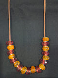 Necklace each one Handcrafted w/ Orange and Red Beads